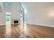 Spacious living room featuring hardwood floors, a fireplace, and soaring ceilings with a chandelier at 140 Grosvenor Pl, Atlanta, GA 30328