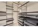 Well-organized walk-in closet with shelves, drawers, and rods for optimal storage at 140 Grosvenor Pl, Atlanta, GA 30328
