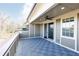 Inviting balcony featuring sleek tiling, neutral railings, and an open-air design with a view at 225 Waterman Se St, Marietta, GA 30060