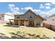 A well-maintained backyard includes a covered patio area and lush green lawn at 3777 Shady Maple Dr, Lithonia, GA 30038