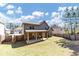 An inviting backyard features a covered patio and a well-maintained lawn at 3777 Shady Maple Dr, Lithonia, GA 30038