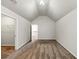 A large carpeted bedroom with neutral paint, and high vaulted ceilings at 3777 Shady Maple Dr, Lithonia, GA 30038