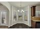 Cozy breakfast nook with hardwood floors and a decorative chandelier at 3777 Shady Maple Dr, Lithonia, GA 30038