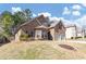 Lovely single-Gathering home with a brick facade, a neatly landscaped yard and a two-car garage at 3777 Shady Maple Dr, Lithonia, GA 30038