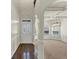 Elegant foyer leads into a dining area with modern lighting and wainscoting detail at 3777 Shady Maple Dr, Lithonia, GA 30038