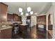 Open kitchen with stainless steel appliances, a central island, and elegant granite countertops at 3777 Shady Maple Dr, Lithonia, GA 30038