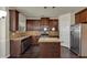 Well-equipped kitchen featuring stainless steel appliances, granite countertops, and custom cabinetry at 3777 Shady Maple Dr, Lithonia, GA 30038