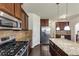 Modern kitchen with stainless appliances, granite countertops, and an island with bar seating at 3777 Shady Maple Dr, Lithonia, GA 30038