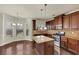 Modern kitchen with stainless steel appliances, center island and a breakfast nook with large windows at 3777 Shady Maple Dr, Lithonia, GA 30038