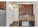 Convenient kitchen area featuring granite countertops, custom cabinetry, and hardwood floors at 3777 Shady Maple Dr, Lithonia, GA 30038