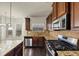 Bright kitchen with stainless steel appliances, granite countertops, and a breakfast nook overlooking the yard at 3777 Shady Maple Dr, Lithonia, GA 30038