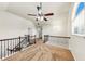 Upstairs landing area with decorative wrought iron railing and a view of windows at 3777 Shady Maple Dr, Lithonia, GA 30038