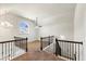 Upstairs landing featuring decorative wrought iron railing at 3777 Shady Maple Dr, Lithonia, GA 30038