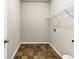 Functional laundry room with tiled floor and wire shelving at 3777 Shady Maple Dr, Lithonia, GA 30038