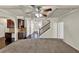 Open-concept living room with coffered ceilings, recessed lights and convenient access to the staircase at 3777 Shady Maple Dr, Lithonia, GA 30038