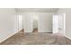 Spacious main bedroom featuring neutral tones, plush carpeting and access to both walk in closet and ensuite at 3777 Shady Maple Dr, Lithonia, GA 30038