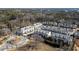 Aerial view of a residential neighborhood with tree-lined streets and manicured lawns at 411 Johnson Ct, Alpharetta, GA 30009