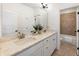 Bright bathroom featuring a double vanity with granite countertop and a separate shower and bathtub at 411 Johnson Ct, Alpharetta, GA 30009