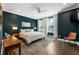 Serene bedroom with hardwood floors, natural light, and neutral tones at 411 Johnson Ct, Alpharetta, GA 30009