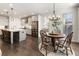 Charming dining area with hardwood floors, chandelier, and natural light at 411 Johnson Ct, Alpharetta, GA 30009