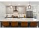 Stylish kitchen featuring a large center island, stainless steel appliances, and pendant lighting at 411 Johnson Ct, Alpharetta, GA 30009