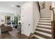 Open-concept living area with hardwood floors and modern finishes at 411 Johnson Ct, Alpharetta, GA 30009
