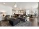 Open-concept living room connecting to a modern kitchen and dining area with a natural light at 411 Johnson Ct, Alpharetta, GA 30009