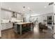 Spacious kitchen with center island that looks onto the living room with fireplace at 411 Johnson Ct, Alpharetta, GA 30009