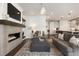 Spacious living room with a modern fireplace, open to the kitchen, ideal for entertaining guests at 411 Johnson Ct, Alpharetta, GA 30009