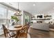 Open-concept living room and dining area features hardwood floors and modern finishes at 411 Johnson Ct, Alpharetta, GA 30009