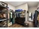 This walk-in closet is equipped with custom shelving and drawers, and includes a dresser and mirror at 411 Johnson Ct, Alpharetta, GA 30009