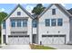 Beautiful new construction townhomes featuring modern farmhouse style and two-car garages at 130 Briargate Dr, Johns Creek, GA 30097