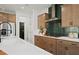 Modern kitchen featuring quartz countertops, stylish backsplash, and stainless-steel appliances at 130 Briargate Dr, Johns Creek, GA 30097