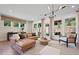 Bright and airy living room with large windows, neutral decor, and stylish furnishings at 130 Briargate Dr, Johns Creek, GA 30097