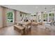 Open-concept living room with modern furnishings, hardwood floors, and ample natural light at 130 Briargate Dr, Johns Creek, GA 30097