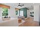 Cozy living room with large windows, hardwood floors, and stylish decor at 130 Briargate Dr, Johns Creek, GA 30097