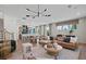 Open-concept living room seamlessly flows into a dining area and kitchen with a modern design at 130 Briargate Dr, Johns Creek, GA 30097