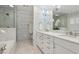 Stylish bathroom with marble floors, custom cabinets, and modern fixtures at 3902 Sheldon Ne Dr, Atlanta, GA 30342