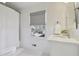 Clean and simple bathroom with a shower, window, and modern white fixtures at 3902 Sheldon Ne Dr, Atlanta, GA 30342
