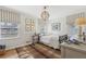 Comfortable bedroom featuring a unique light fixture, ample natural light, and neutral decor at 3902 Sheldon Ne Dr, Atlanta, GA 30342
