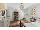 Bedroom featuring a unique light fixture, ample natural light, and hardwood floors at 3902 Sheldon Ne Dr, Atlanta, GA 30342