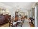 Formal dining room with a large wood table, classic chairs, overhead lighting, and hardwood floors at 3902 Sheldon Ne Dr, Atlanta, GA 30342