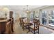 Formal dining room with a large wood table, classic chairs, and access to an outdoor patio through glass doors at 3902 Sheldon Ne Dr, Atlanta, GA 30342