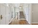 Inviting entryway featuring hardwood floors and stairs leading to the upper level at 3902 Sheldon Ne Dr, Atlanta, GA 30342