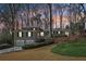 Charming home featuring an attached garage and well-manicured lawn at 3902 Sheldon Ne Dr, Atlanta, GA 30342