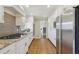 Beautiful kitchen featuring stainless appliances, granite countertops and white cabinets at 3902 Sheldon Ne Dr, Atlanta, GA 30342