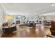 Spacious living room with hardwood floors, fireplace, and views into the dining room at 3902 Sheldon Ne Dr, Atlanta, GA 30342