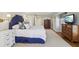 Main bedroom features elegant decor, including a blue headboard and stylish furniture at 3902 Sheldon Ne Dr, Atlanta, GA 30342