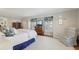 Bright main bedroom showcases a sitting chair, television, and decorative wall art at 3902 Sheldon Ne Dr, Atlanta, GA 30342