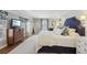 Comfortable main bedroom with blue accents, decorative pillows, and ample natural light at 3902 Sheldon Ne Dr, Atlanta, GA 30342
